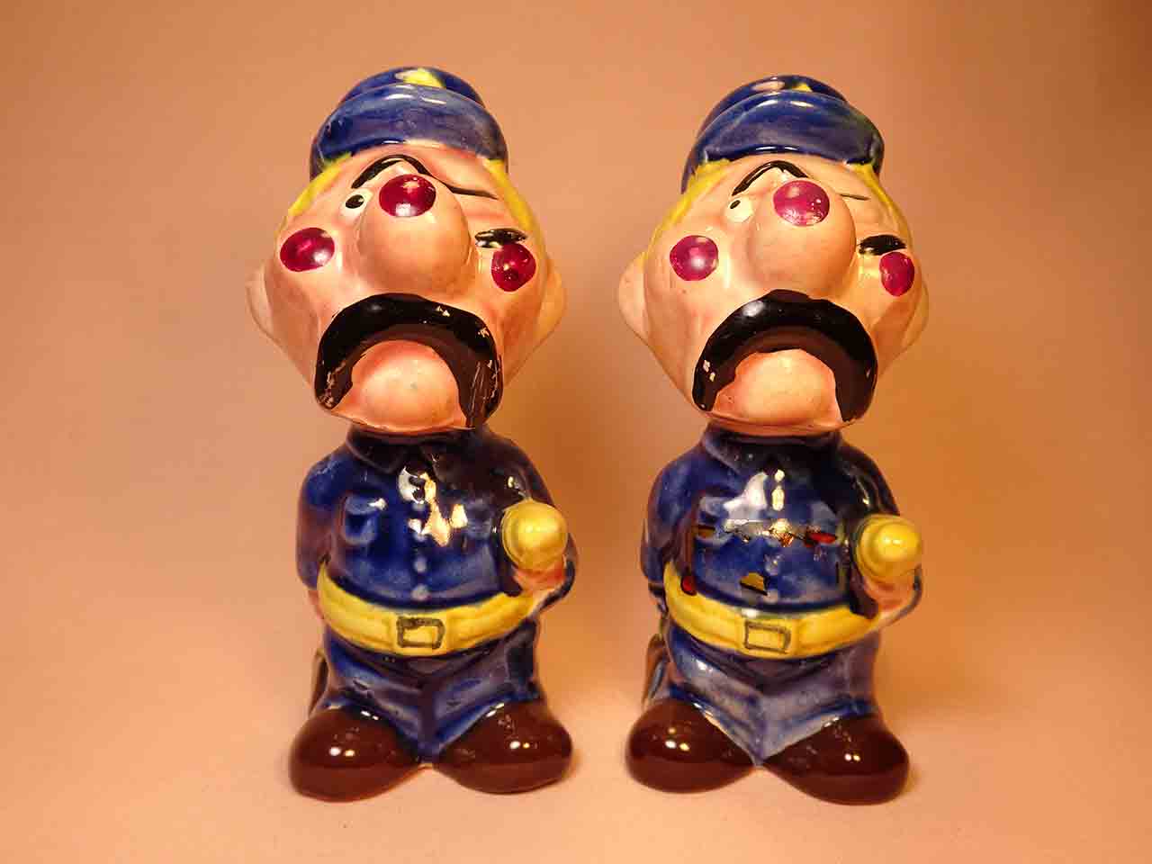 43615 Clown-like strange fellows salt and pepper shakers - police officers