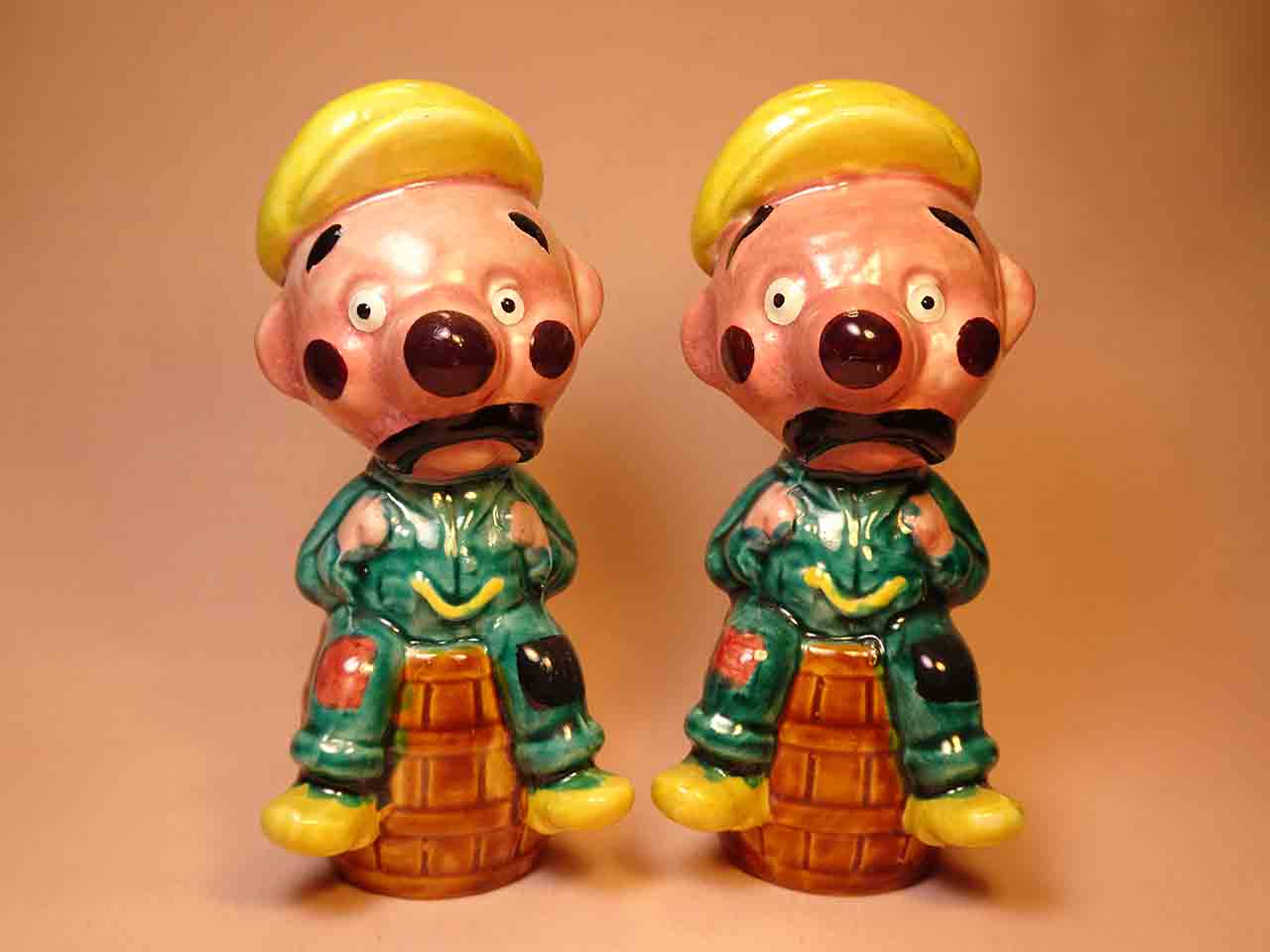 43617 Clown-like strange fellows salt and pepper shakers - guys on barrels